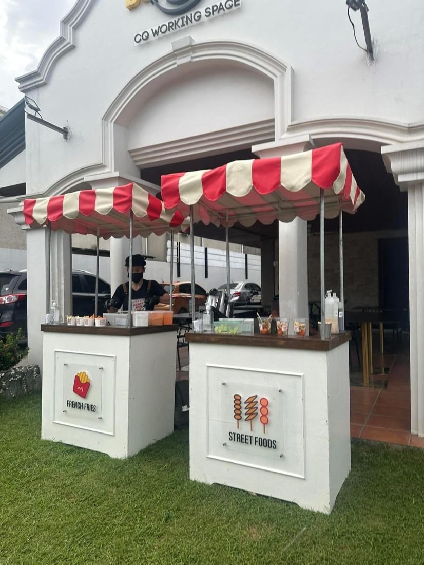 French fries and street food carts outside a co-working space