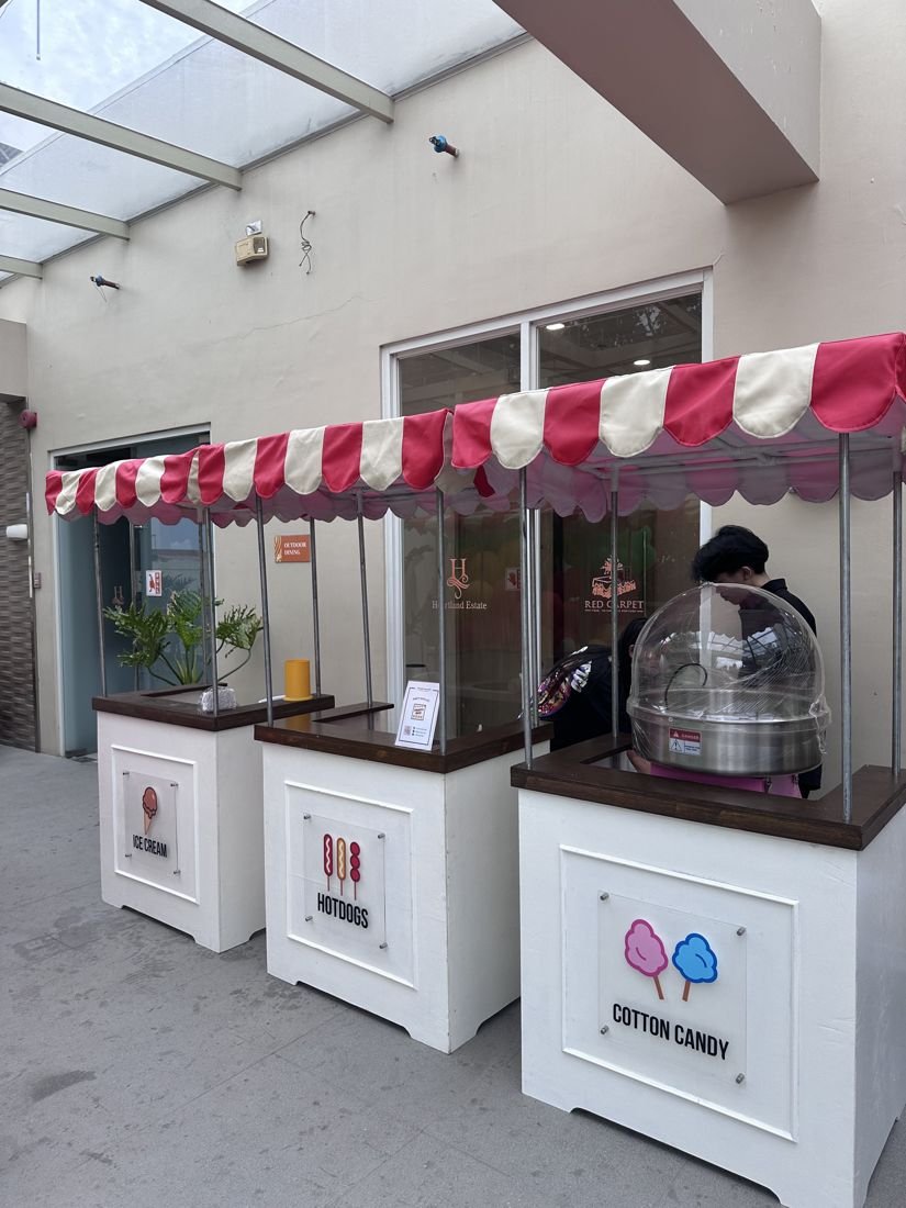 Ice cream, hotdog and cotton candy carts at an events venue